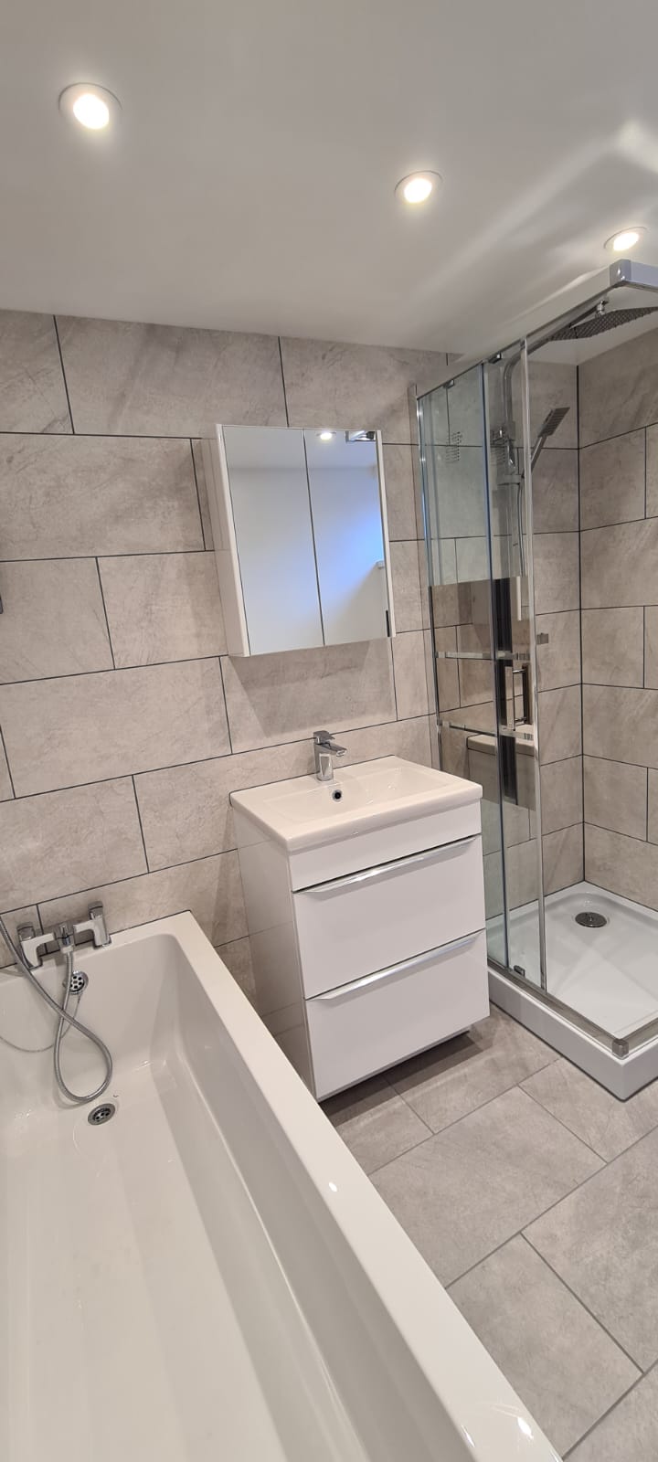 Marble-tiled walk-in shower and vanity, Plymouth