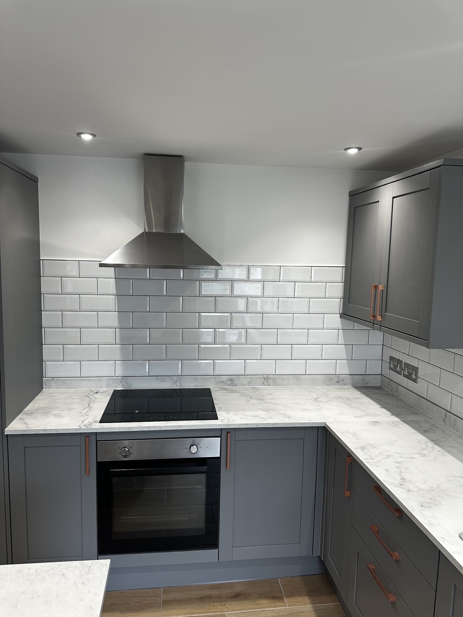 Grey shaker kitchen with metro splashback and marble worktop, Plymouth